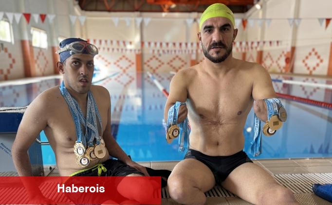 Birbirlerinden güç alan iki engelli sportmen madalyaya doymuyor