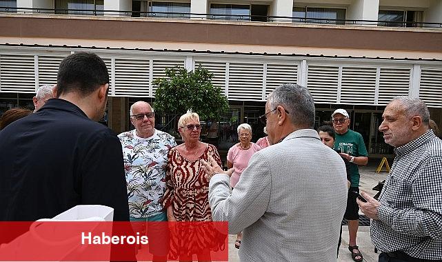 Alman ikili Lider Topaloğlu'ndan teşekkür plaketi